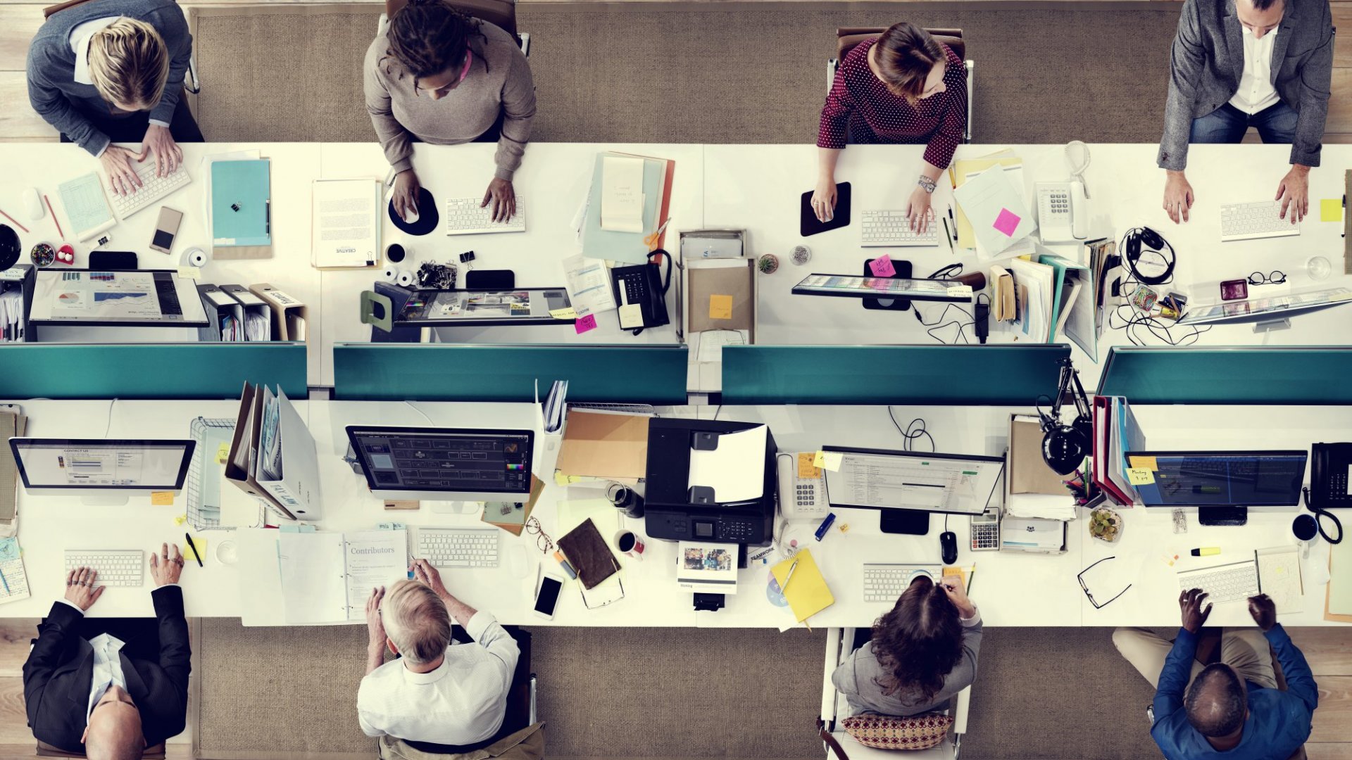employees working in an open space office.